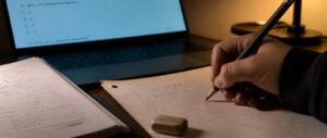 Student working through assertion reason questions NEET 2027 using a rough sheet method, assertion reason questions NEET 2027