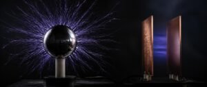 Electrostatics NEET PYQ analysis shown as a charged metal sphere with field lines and capacitor plates